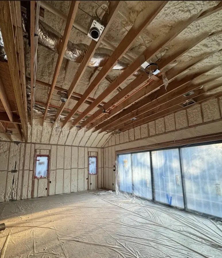 Interior walls and ceiling insulated with spray foam during new construction in Milton